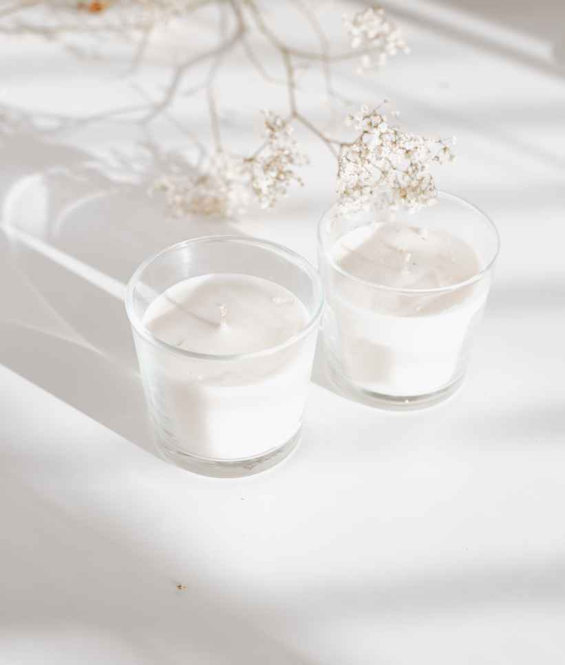 Glasses of Candles with Fresh Flowers