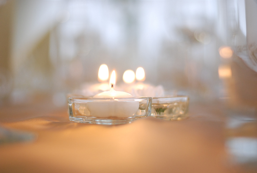 Clear Glass Candle Holder With Lighted Candle